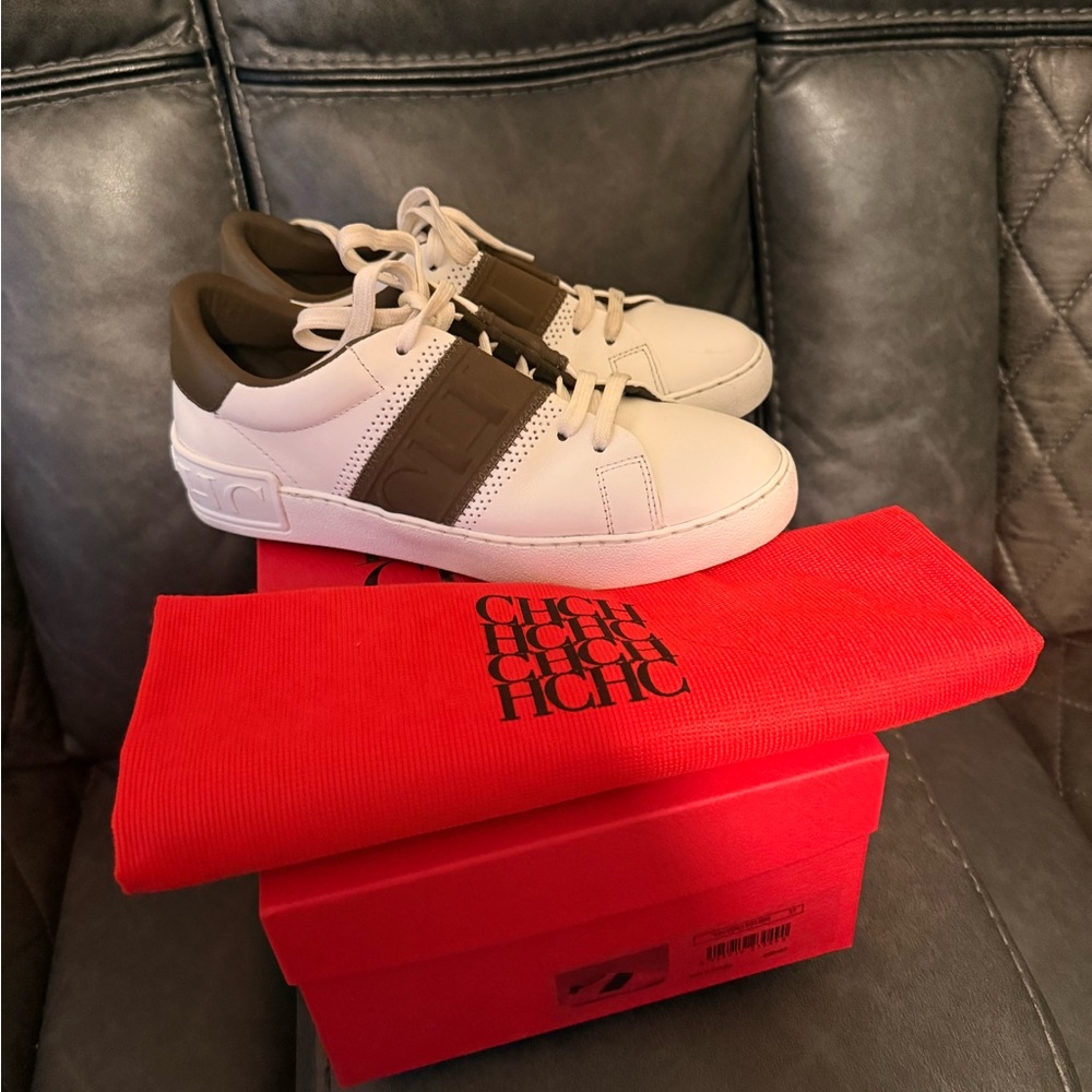 Pre owned Carolina Herrera Leather sneakers with CH Tape.